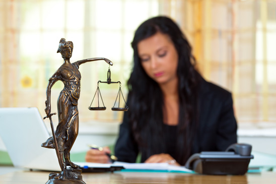 woman lawyer and Themis statue