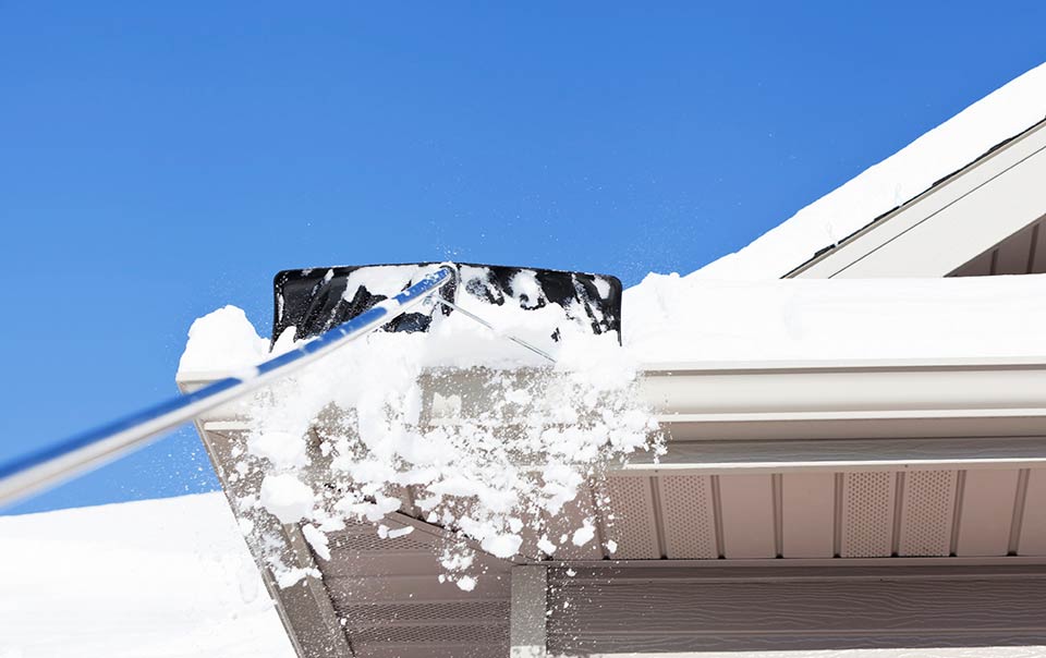 removing snow from roof with rake