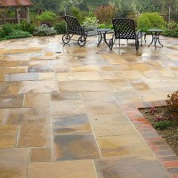 natural stone patio with garden furniture