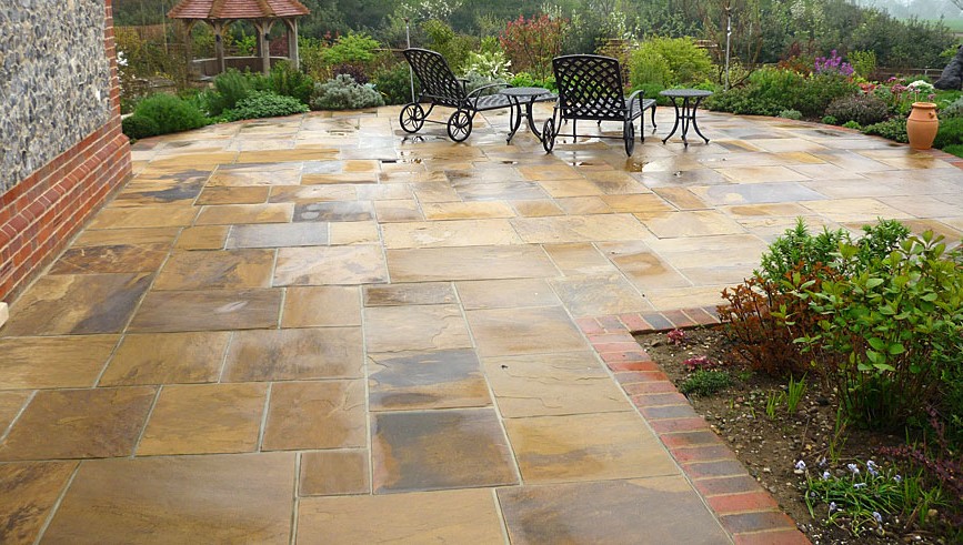 natural stone patio with garden furniture