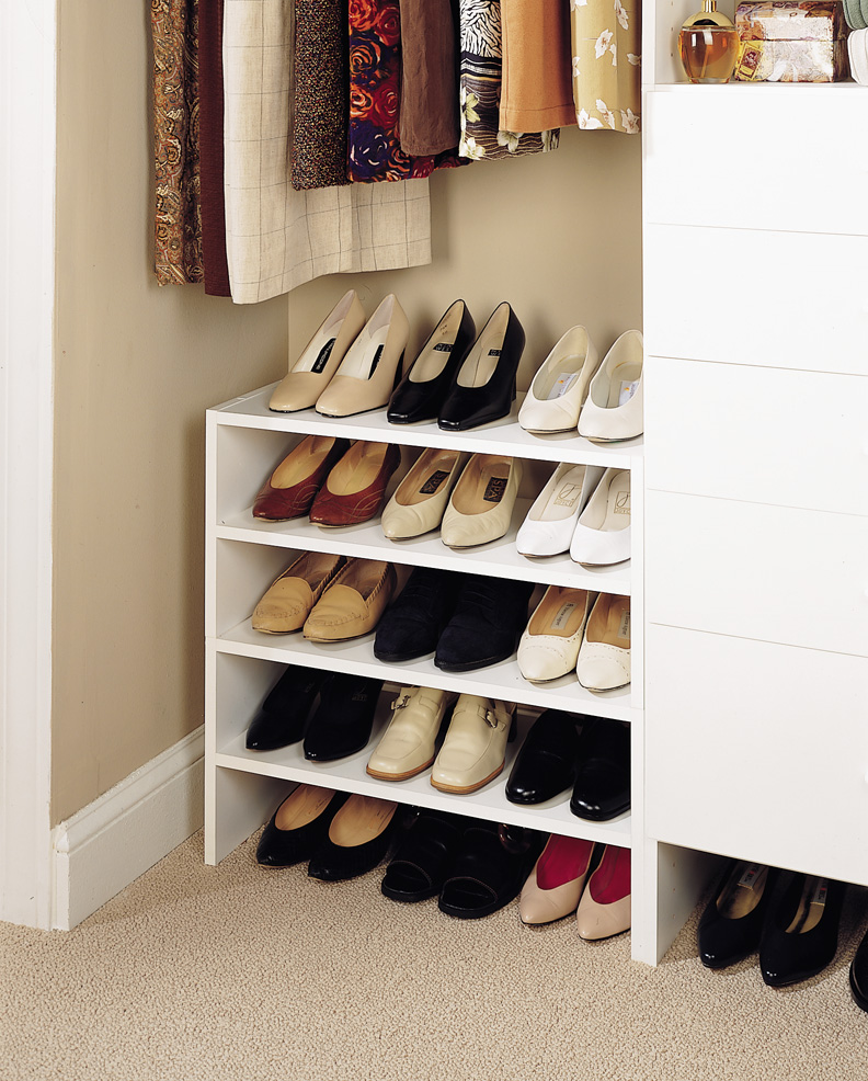 white shoe shelves in closet