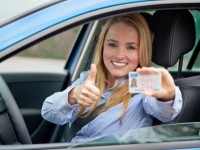 woman in car happy to get driving license