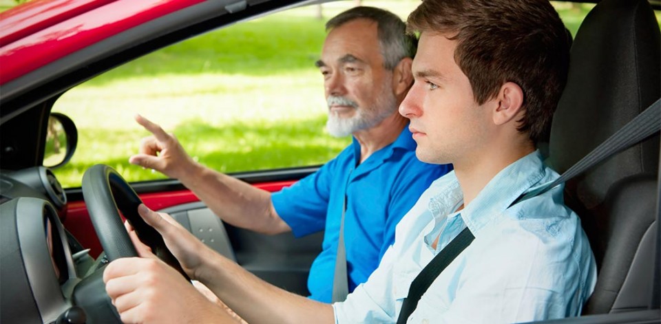 man learning to drive with instructor