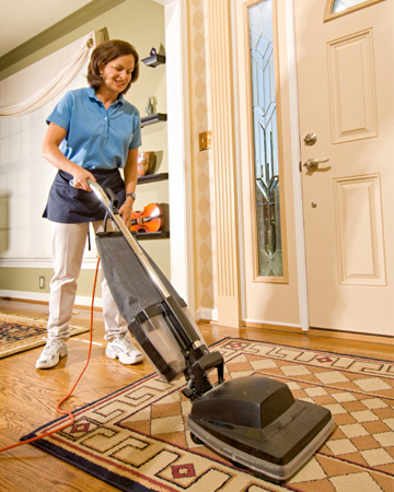 housekeeper vacuuming