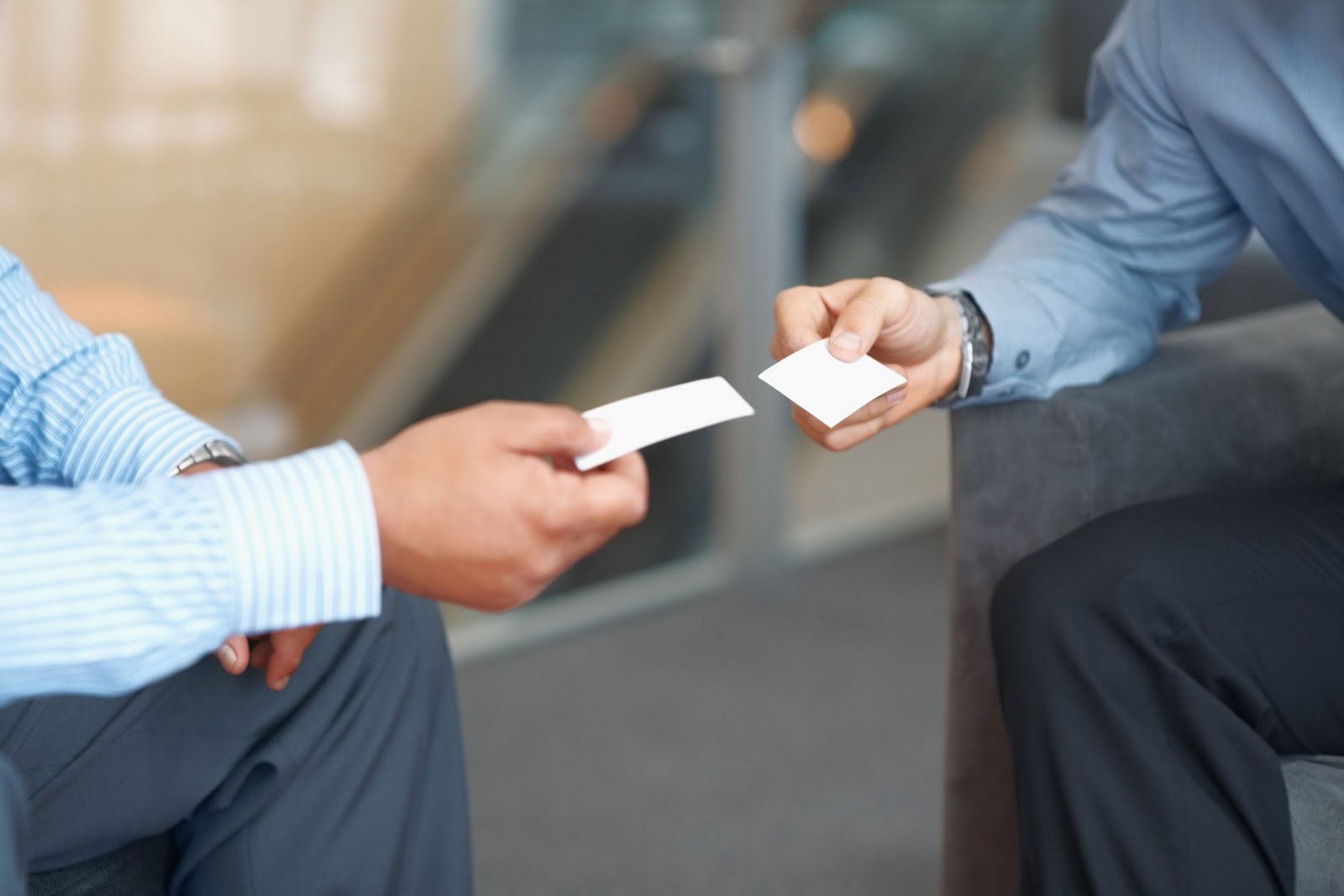men exchanging business cards