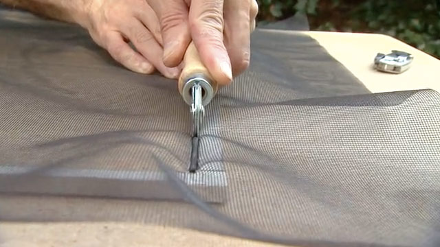man showing how to replace window screen