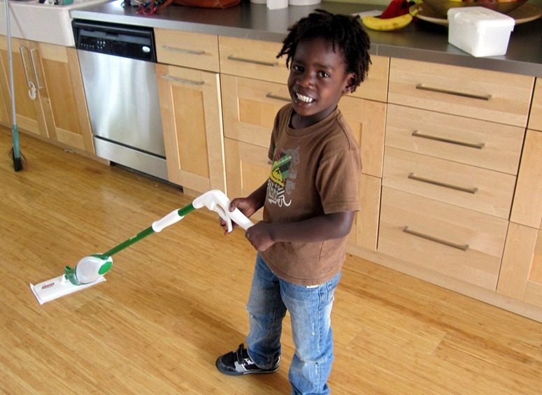 boy mopping the floor chore