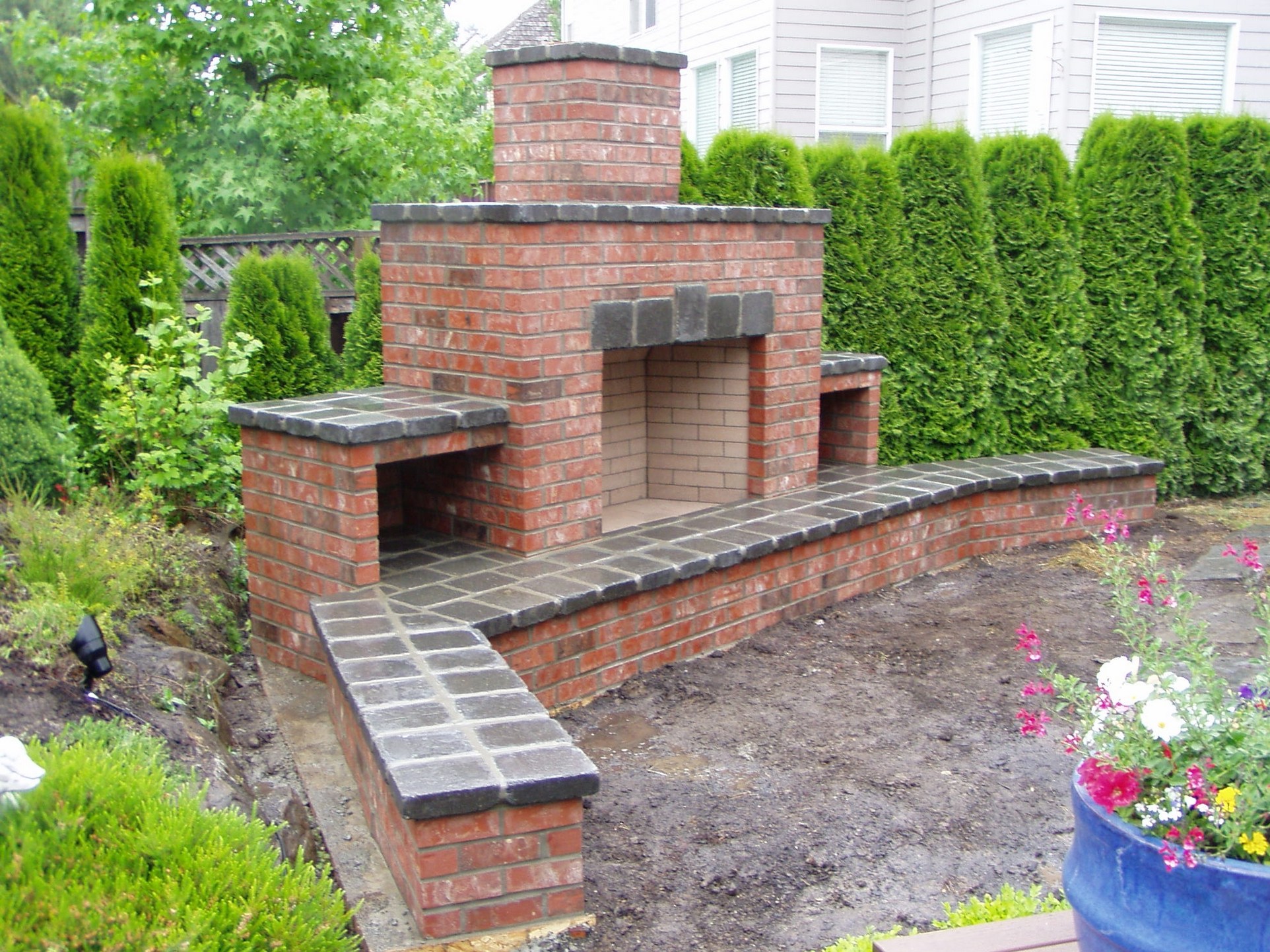 unfinished red brick fireplace