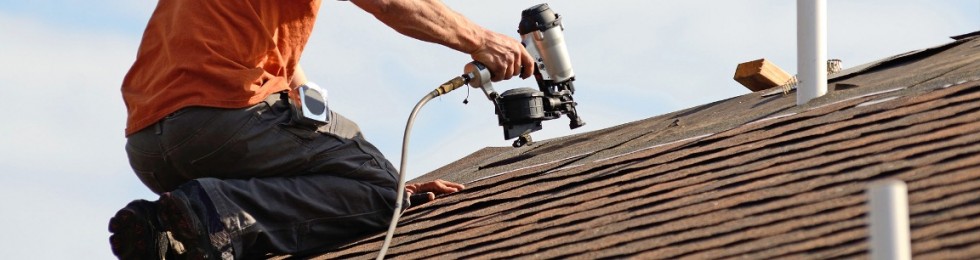 roofing contractor repairing a roof leak