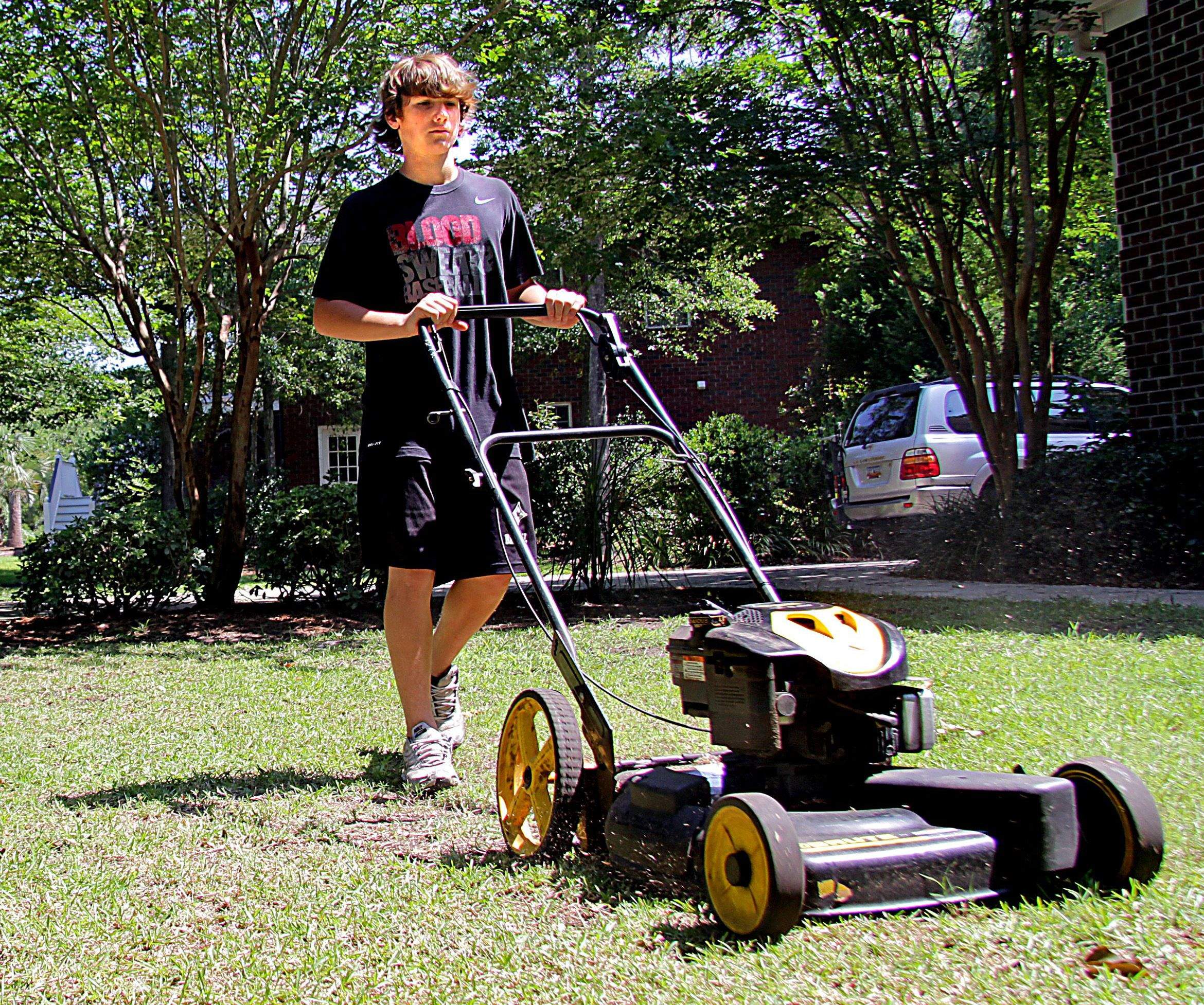 teenage boy mowing the lawn summer jobs for teens