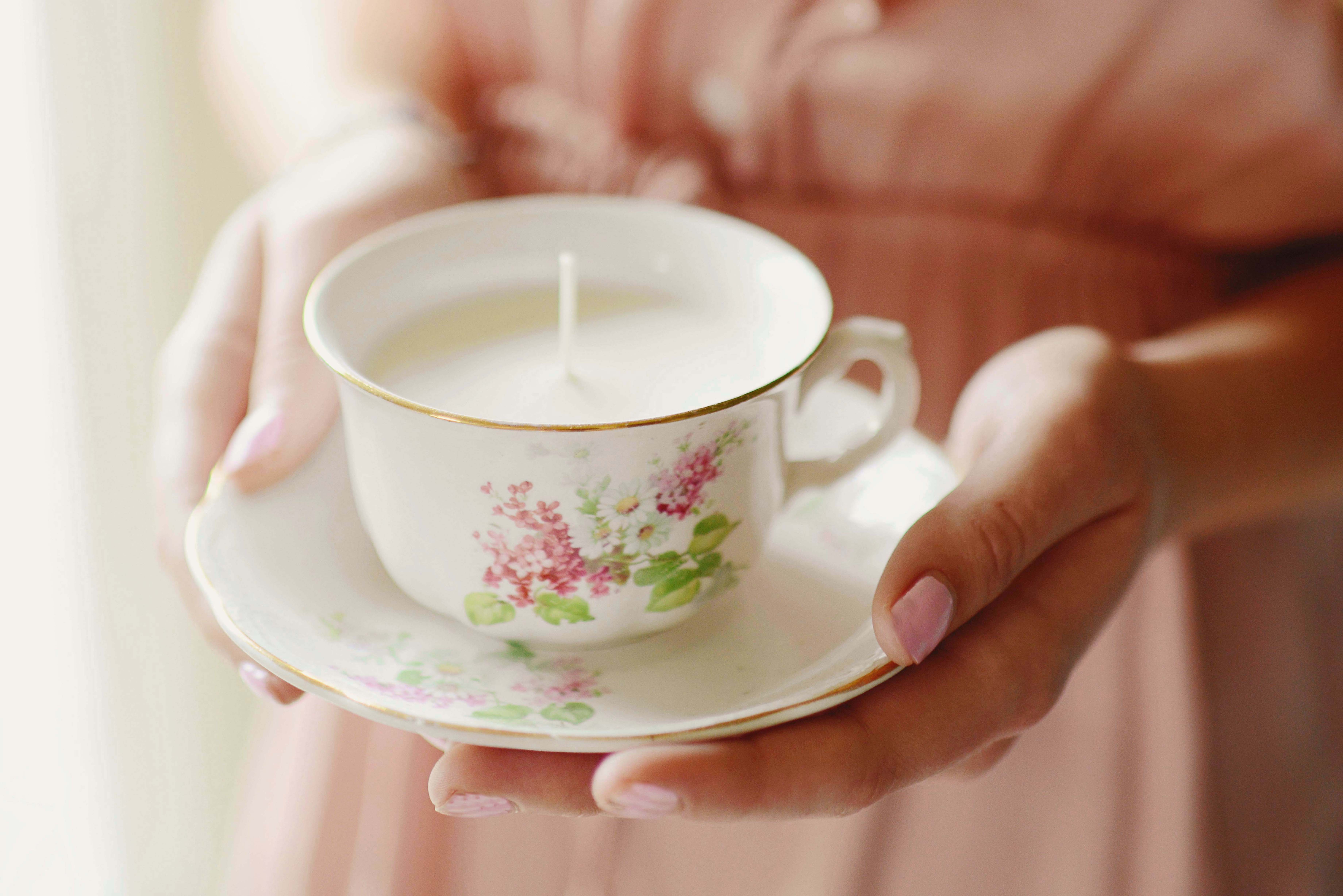 woman holding a teacup candle mothers day gift idea