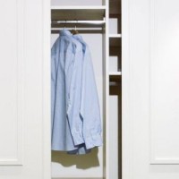 blue shirt hanging in white closet
