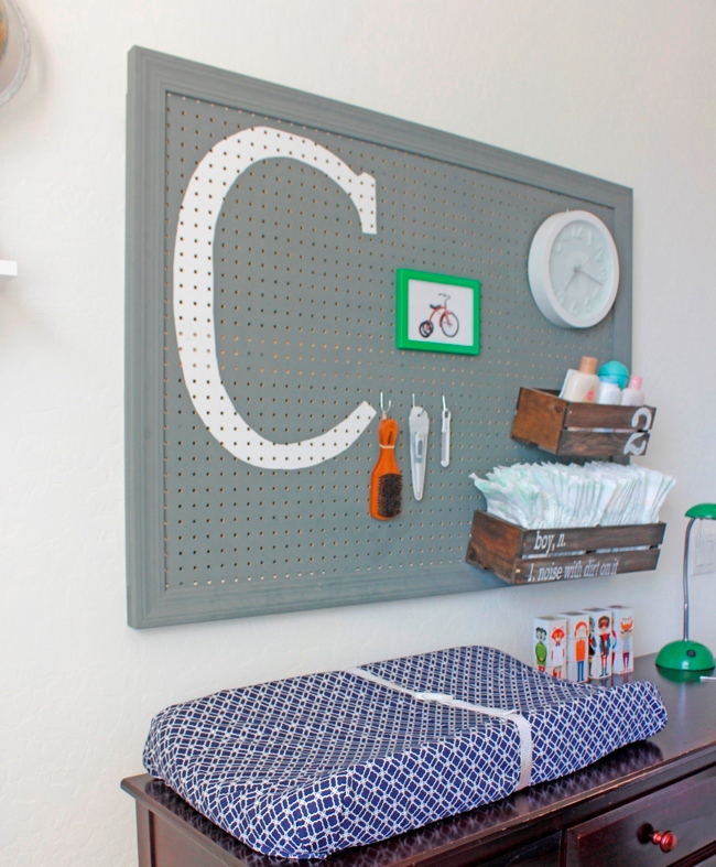 changing station in nursery with a peg board