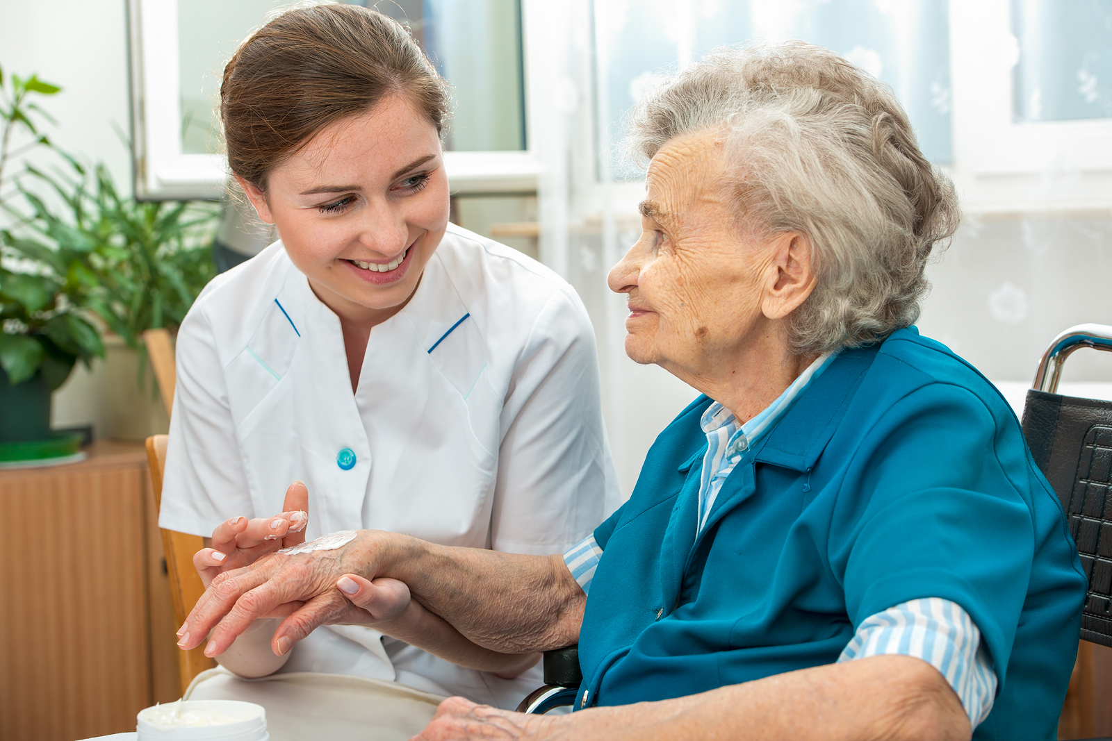 nurse caregiver with an elderly woman