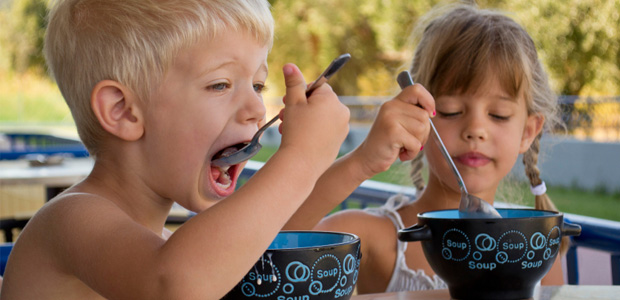 boy and girl eating breakfast