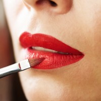 Lip makeup, red lipstick, lipstick brush, beautiful young brunet