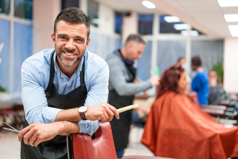 Hairdresser stands in a hairdressing studio