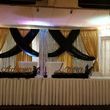 Photo #2: Leather throne chair, fabric draping backdrop, balloon decorating