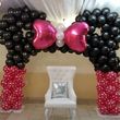 Photo #4: Leather throne chair, fabric draping backdrop, balloon decorating