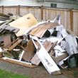 Photo #2: Demolition - from storage sheds to houses