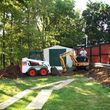 Photo #1: Demolition - from storage sheds to houses
