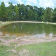 Photo #3: **PONDS, LAKES, HEAVY LAND CLEARING, AND FENCE BUILDING
